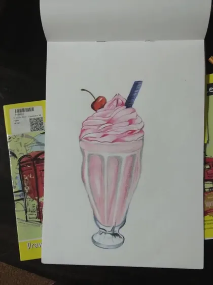 A finished drawing of a strawberry milkshake, done with color pencils. It looks good enough to drink.