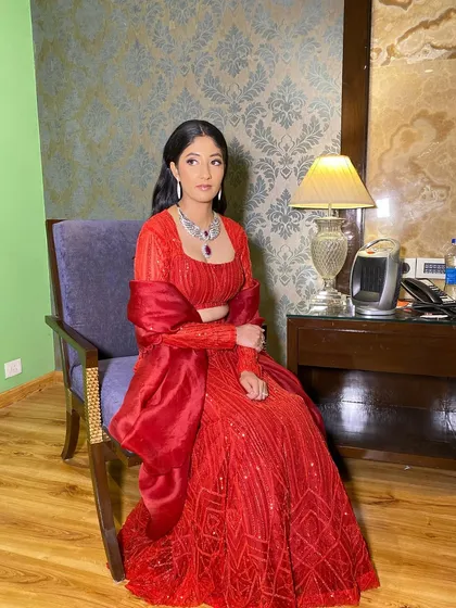 The full look for Pooja's cocktail night. She exudes elegance and sophistication, with her makeup perfectly complementing her ensemble.