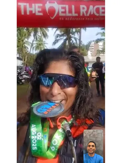 Biting the medal is a feeling every endurance athlete earns. Celebrating a hard-fought finish at The Hell Race in Goa.