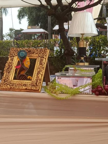 A detail shot of our bar decor, including an ornate gold frame and elegant glass lamps.