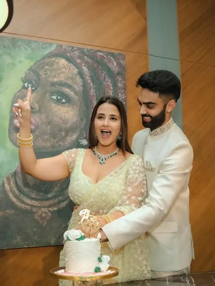The celebration begins! Capturing the fun and joyful moments, like the cake cutting at an engagement, is essential. It’s these unposed, happy memories that truly tell the story of your day.