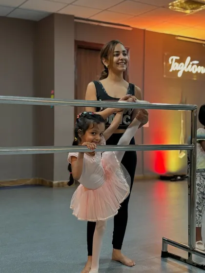 Stretching at the barre is a fundamental part of every ballet class. I love guiding my students as they build the flexibility and strength needed for graceful movements.
