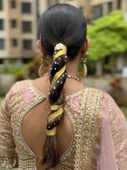 A still image of the modern ribbon braid. This style is quick to create once you master the technique, making it a great addition to your list of party and event hairstyles.