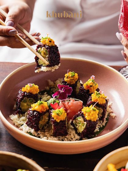 Another look at our innovative black rice sushi. It's a feast for the eyes and the palate, perfect for sharing with someone special.