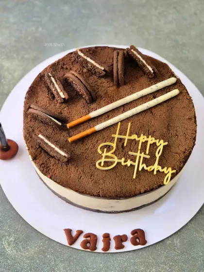 This is my Cookies & Cream Cheesecake, made for a birthday celebration. It features a crunchy cookie base, a creamy cheesecake layer, and is topped with chocolate dust and more cookies for a delightful texture.