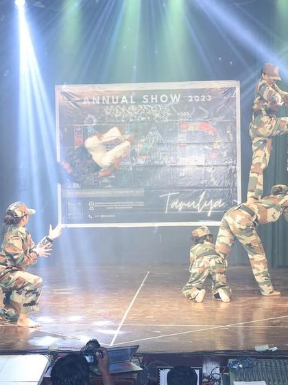 Another complex human pyramid from our army-themed performance, demonstrating the physical strength and trust among our dancers.