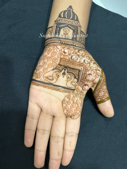 A step-by-step look at how a peacock and palace design is built up. From the initial outline to the final detailed filling, you can see the process unfold.