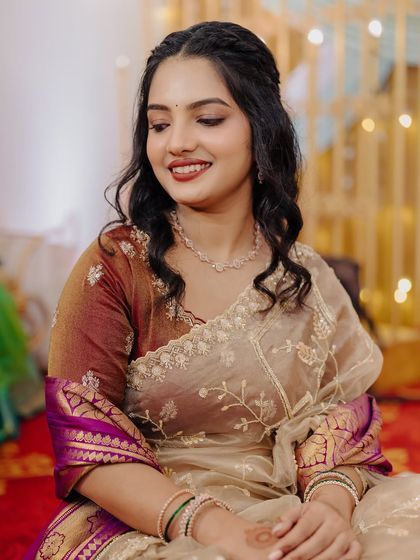 A flawless glass-finish makeup look for this engagement bride, looking dreamy in an organza saree.