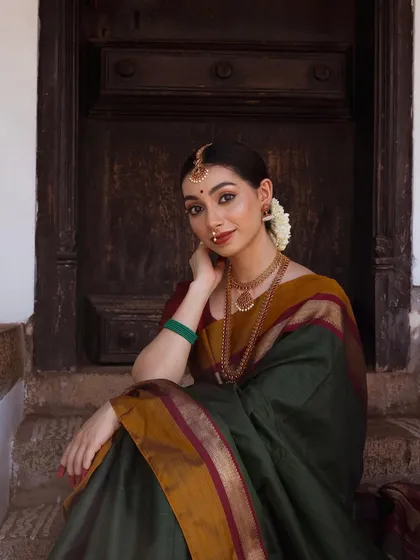 I have a deep passion for heritage jewelry, and this shoot allowed me to embody a classic South Indian aesthetic. The focus here was on showcasing the intricate details of the temple jewelry and the rich texture of the silk saree, creating a timeless bridal or festive look.