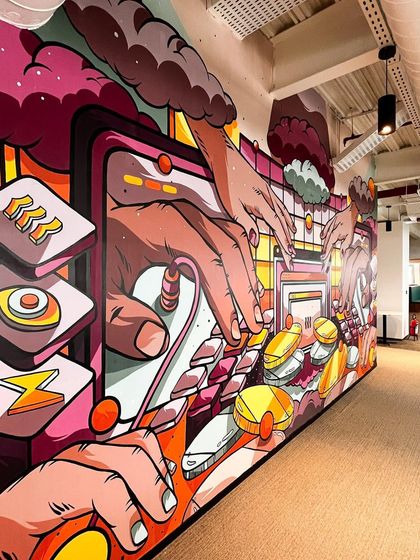 An angled view of the engineering mural, showing its depth and vibrant color palette.