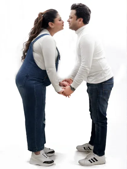 I love capturing those in between moments that feel natural and fun. This playful pose, with the couple leaning in for a kiss, shows their sweet connection and the joy of this special time together.