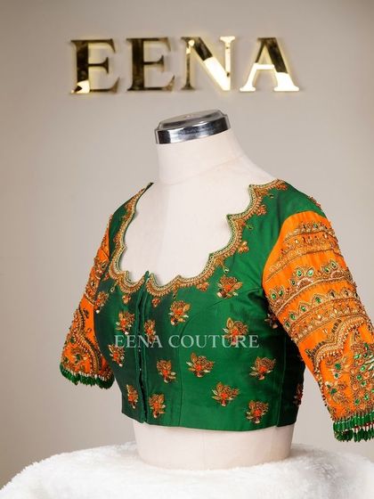 This blouse is a celebration of vibrant color and artistry. I used a rich green raw silk base and contrasted it with bright orange sleeves, which feature incredibly detailed peacock embroidery using zardozi, stones, and beadwork.