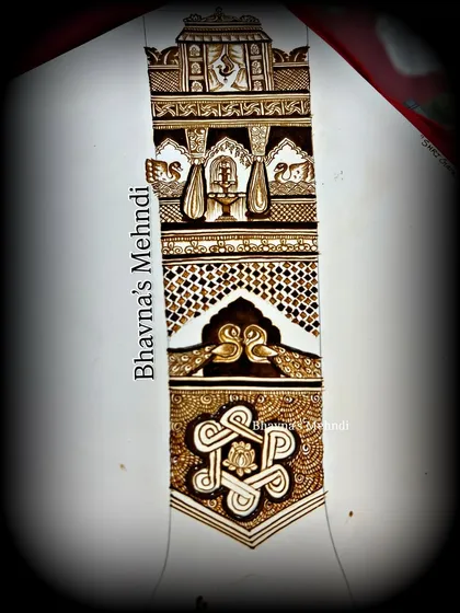 A full design layout on paper, combining different elements like peacocks, elephants, and auspicious symbols.