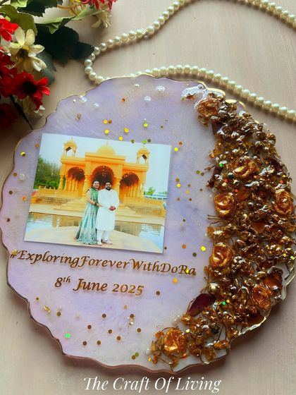 A lovely geode-style plate with a lavender background, featuring preserved golden roses and the couple's wedding hashtag. The glitter mixed into the resin adds a subtle sparkle.