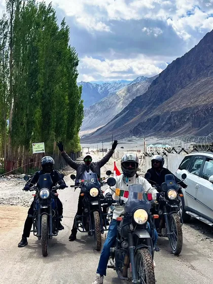 Another shot of our bikers enjoying the ride through a green valley, a rare and beautiful sight in Ladakh.