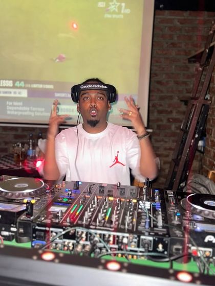 Behind the decks at a club night, bringing the energy. This is my element, controlling the sound and the mood.