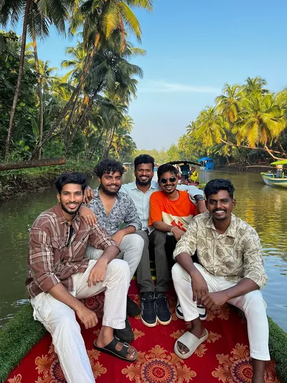 A group of guys enjoying the boat ride through the mangrove forest.