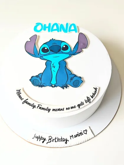 "Ohana means family." This simple and sweet Lilo & Stitch cake features an edible image of Stitch with his famous quote. It's a no-fondant design that's perfect for a fan of the movie.