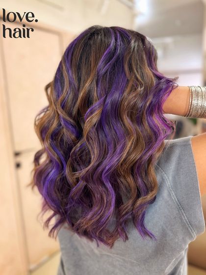 A side view of the 'toffee crunch and blackcurrant' look, showing how the purple highlights are woven through the brown base.