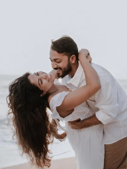 The carefree spirit of love captured during a pre-wedding shoot on the beach. These sessions are all about celebrating your connection in a relaxed, natural setting before the big day.