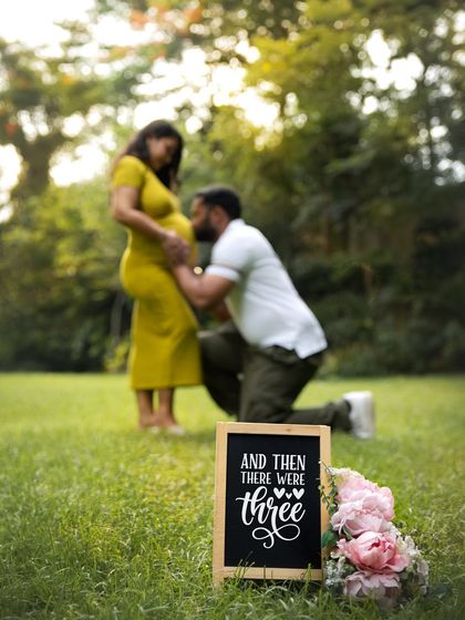 "And then there were three." Using a simple chalkboard sign in a beautiful outdoor setting is a classic and charming way to announce that your family is growing.