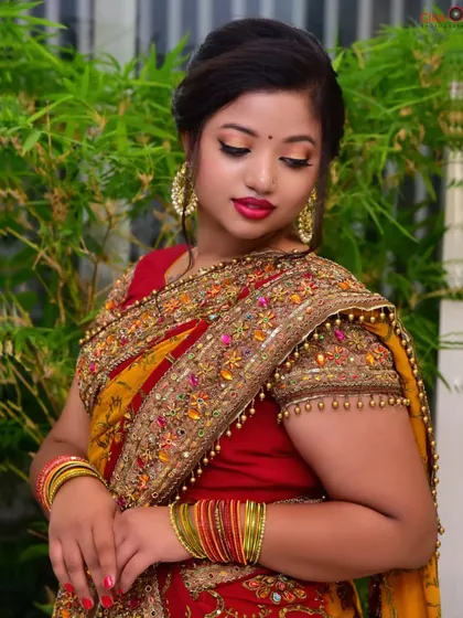 A contemplative portrait with the model looking down. This pose creates a serene and graceful mood, adding emotional range to the photo series.