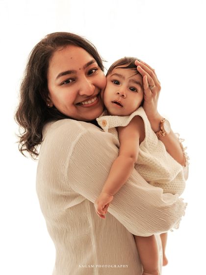 A sweet cuddle between mother and baby.