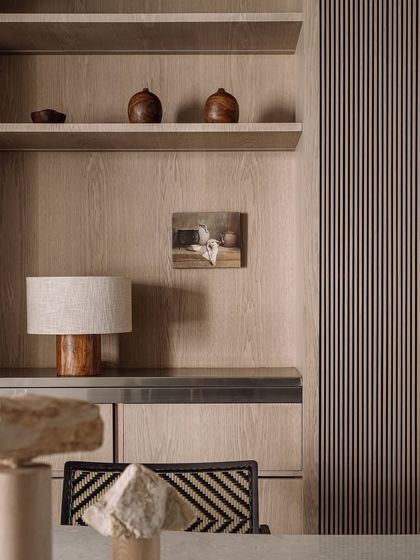 A moody detail shot showing the texture of the wood and the soft, diffused light. It’s these quiet compositions that give Kanso House its soul.
