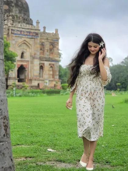 Another lovely walking shot, this time with a smile. The movement in her hair and dress adds a dynamic, carefree feel to this lifestyle portrait.