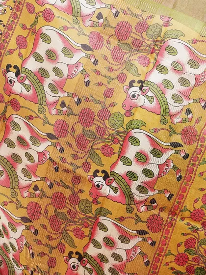 A close-up of the Kamadhenu (holy cow) motif, a central element of Pichwai art.