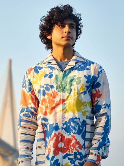 This multi-colored printed linen shirt is a canvas for your spirit. Let your vibrant personality shine through in this statement piece, perfect for summer.