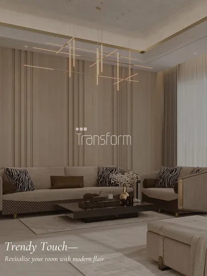 This living room showcases a modern flair with its linear chandelier and paneled walls. The zebra-print cushions add a trendy touch to the otherwise calm and neutral space.