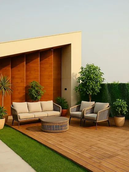 This Faridabad terrace is ready for relaxation. The combination of a wooden deck, artificial grass, and a vertical garden wall creates a low-maintenance space that is always green and inviting. The comfortable outdoor sofa completes the setup.