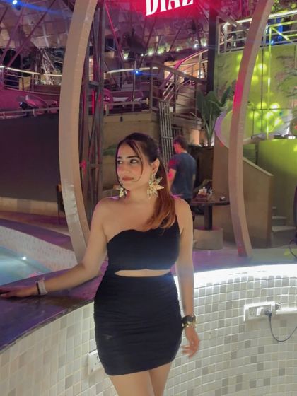 Another shot by the pool, showing the cutout detail of the dress. I make sure to highlight the unique features of each outfit.