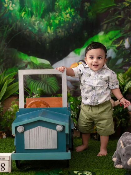 A little driver on a jungle safari. The jeep prop is a favorite among the kids and adds a great element of play to the session.