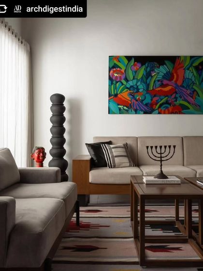 Our colorful canvas of tropical birds featured in Architectural Digest, adding a vibrant splash of color to a contemporary living room.