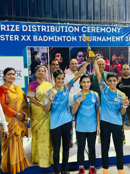 The girls' team celebrating their victory at the CBSE Cluster XX Badminton Tournament. Holding that trophy high is a feeling that can only be earned through sweat and sacrifice.