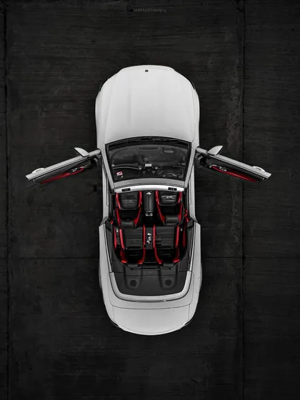 A top-down drone shot of a convertible Mercedes, focusing on the clean lines and bold interior. This demonstrates a different, more commercial style of aerial photography.