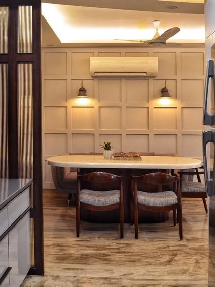 A look from the kitchen out into the dining area, showing how we created a semi-open layout that connects the two spaces while maintaining a sense of separation.