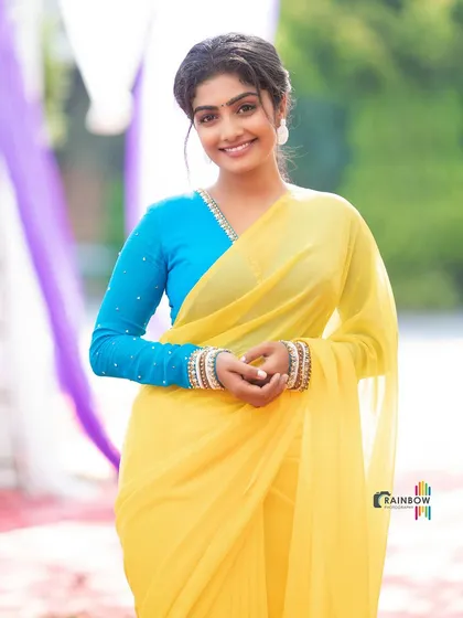 A simple yet striking look with a bright yellow chiffon saree and a contrasting blue blouse. This photo shows how I use color and simple poses to create clean, eye-catching fashion portraits.