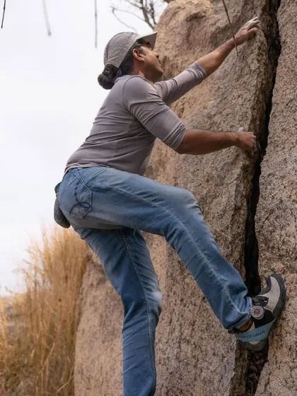 Yogi focused on a crack climb. His story of starting climbing to overcome a fear of heights is an inspiration to many in our community.
