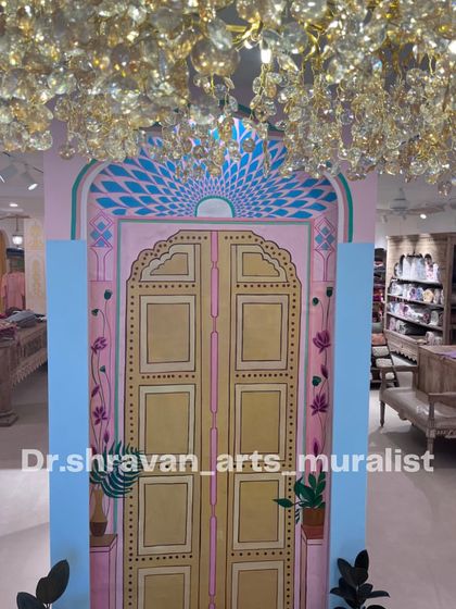 A beautiful Jaipur door painted on canvas for a clothing store. This piece helps transport customers and reinforces the brand's aesthetic.