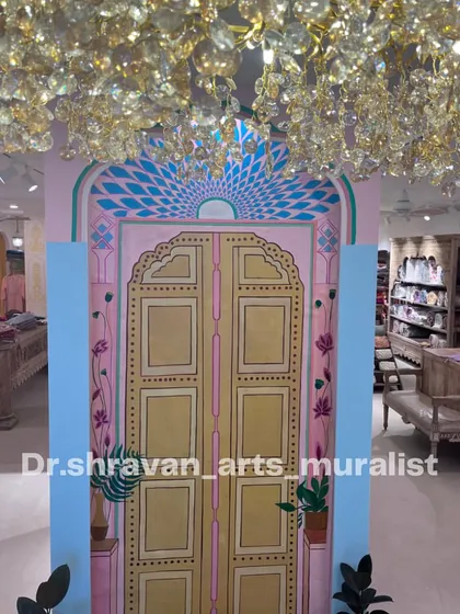 A beautiful Jaipur door painted on canvas for a clothing store. This piece helps transport customers and reinforces the brand's aesthetic.
