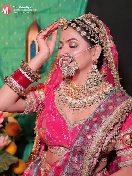The 'borla' (a type of maang tikka) is iconic to Rajasthani culture. You'll learn how to style hair and makeup around such traditional headpieces.