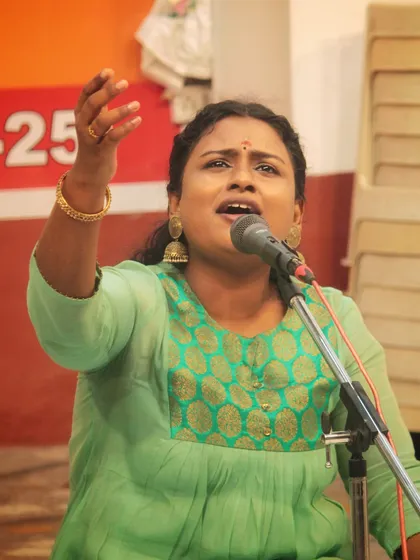 A student using expressive hand movements to convey the 'bhaav' of her song. This connection between gesture and voice is a key part of our teaching.