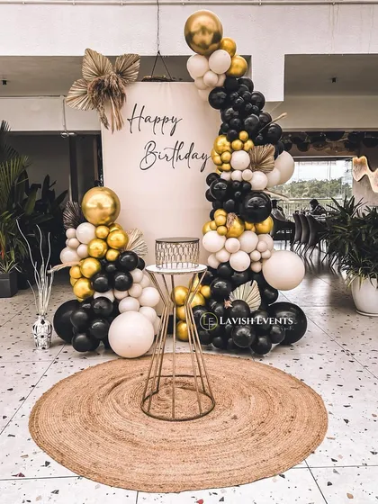 A sophisticated black, white, and gold balloon arrangement for an elegant birthday.