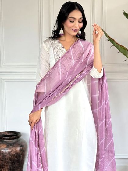 An elegant white chanderi kurta paired with a beautiful printed lavender dupatta. It's a classic combination that's perfect for a sophisticated, graceful look.