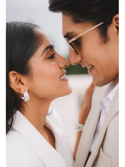 A beautiful, intimate close-up capturing the moments just before a kiss. This shot from Baku focuses on the couple's happy expressions and the undeniable chemistry between them.