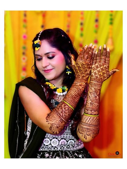 A portrait of the bride showcasing her elaborate mehndi design. We make sure to get detailed shots of the henna art.