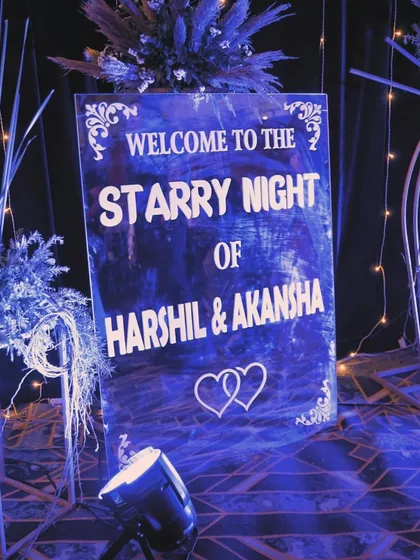 A custom welcome sign for the 'Starry Night' sangeet. The deep blue design, elegant font, and surrounding decor immediately immersed guests in the celestial theme of the evening.